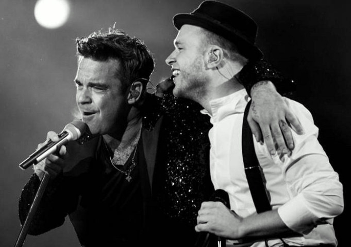 Hatten gemeinsam Spaß auf der Bühne im Schalker Stadion: Robbie Williams (links) und Olly Murs