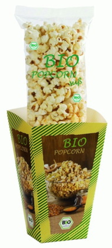 Ein Beutel mit Bio-Popcorn samt Faltschachtel der Firma PCO Group und der hochwertige "Leihwärmer" dazu
