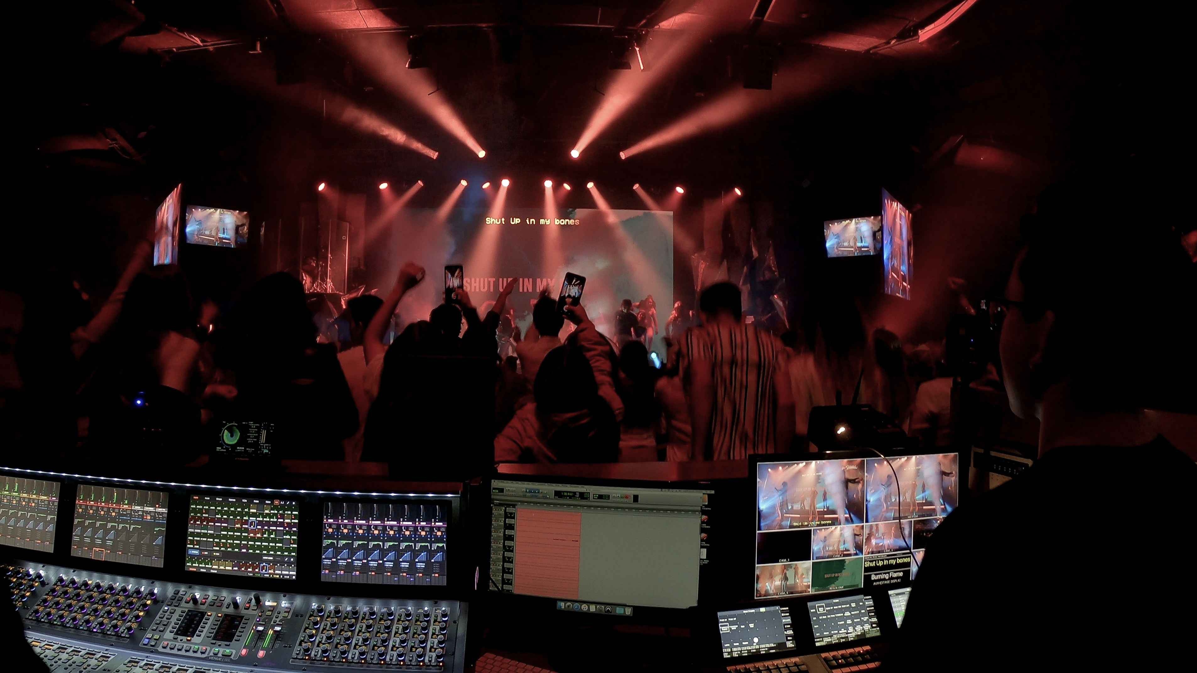 Christian concert foh with lights, view from the sound console and lights console